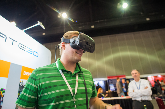 A Solidworks World attendee tries out VR experience in a partner's booth (image courtesy of Solidworks).