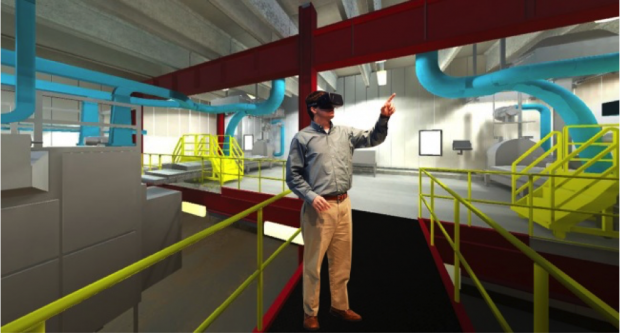 Fig. 7: An engineer using a VR HMD inside a CAVE. (Join Gray Construction)