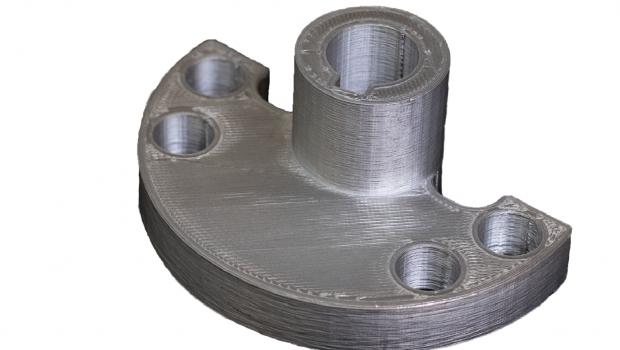 This metal flange printed on a Metal X 3D printer is a part of a wheel shaft assembly designed as an alternative to an original part that is inefficient in machine time and material costs to make. Image courtesy of Markforged Inc. and Stanley Infrastructure.