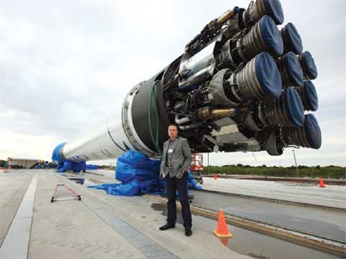 SpaceX founder, CTO and CEO Elon Musk stands with Falcon 9 at Cape Canaveral AFS.